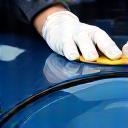 Hands applying ceramic coating